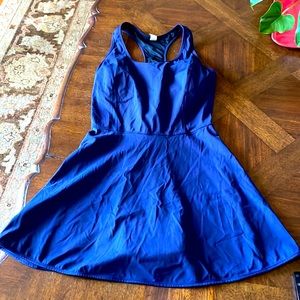 Nylon and spandex dress in navy with a built-in bra. Size large